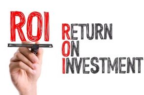 Main display of "ROI" and "Return on Investment" with a hand holding a marker.